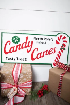 23.6” Metal Holiday North Pole’s Finest Candy Canes Wall Sign
